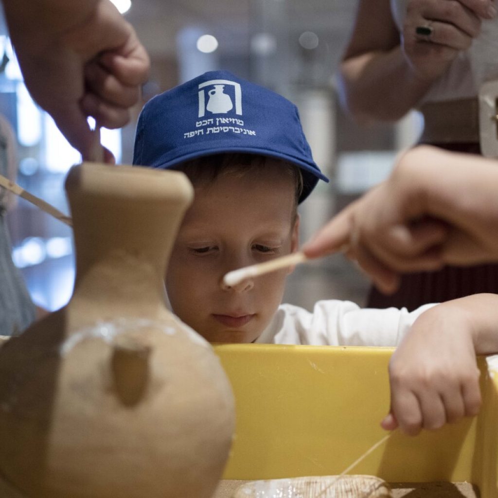 An Israeli boy who broke an ancient jar learns how the museum is piecing it back together