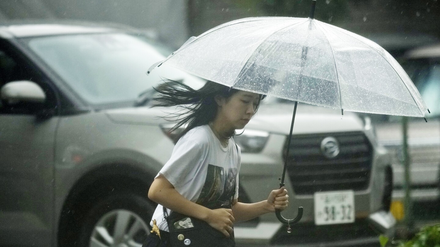 Storm slowly heads toward Japan’s capital, leaving mudslides and broken bridges in its path