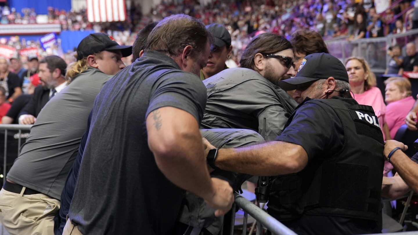 Police say a man will face charges after storming into the press area at a Trump rally