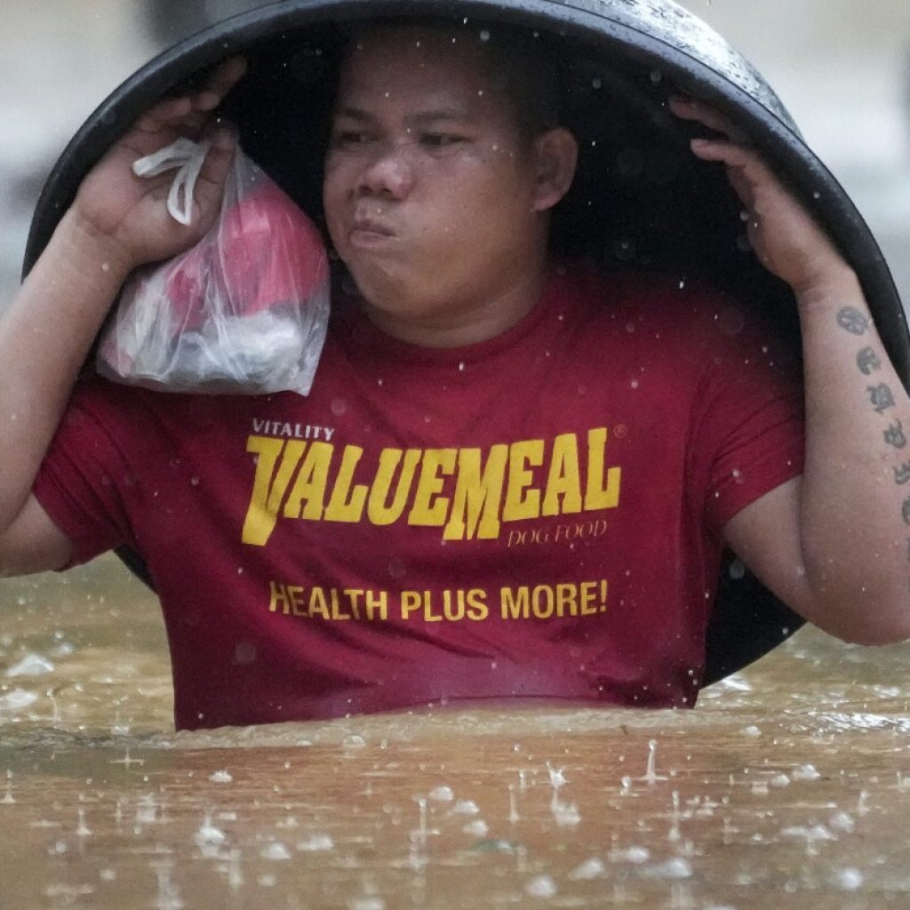 Fierce storm blows out of northern Philippines after leaving 14 dead in landslides and floods