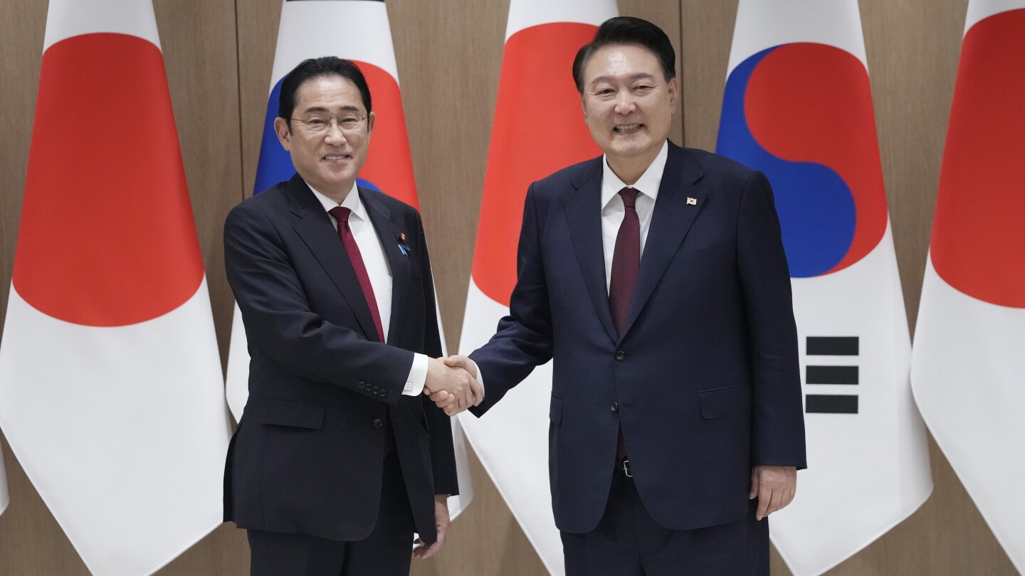 Japan’s leader makes farewell visit to South Korea to strengthen his legacy of warming ties