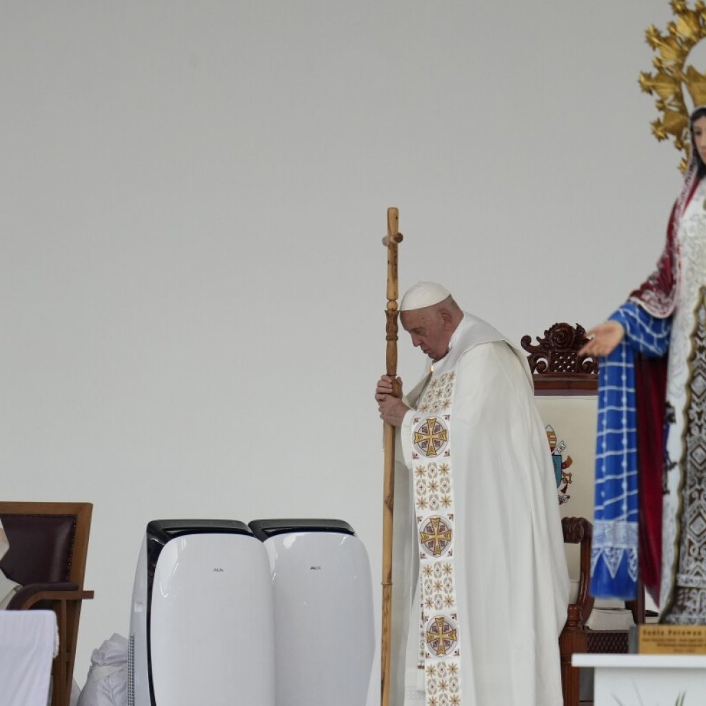 Pope heads to Papua New Guinea after final Mass in Indonesia before an overflow crowd of 100,000