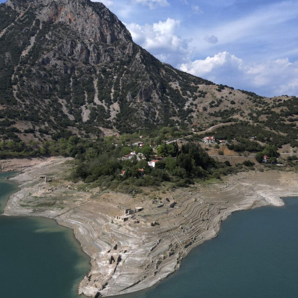 Ruins of a long-sunken Greek village emerge as drought saps a vital reservoir