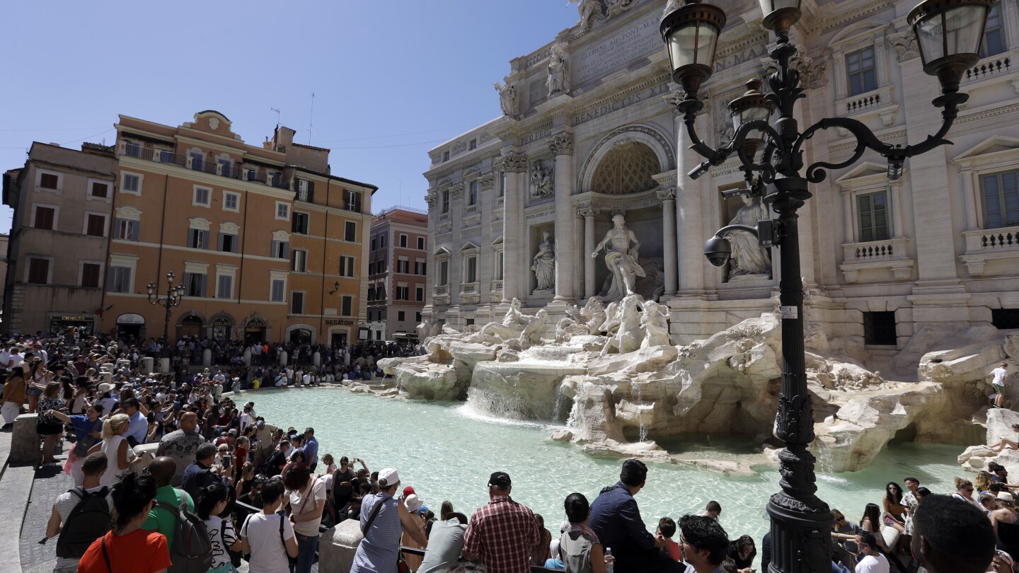 Rome considers imposing a fee to discourage crowds and plunges at Trevi Fountain