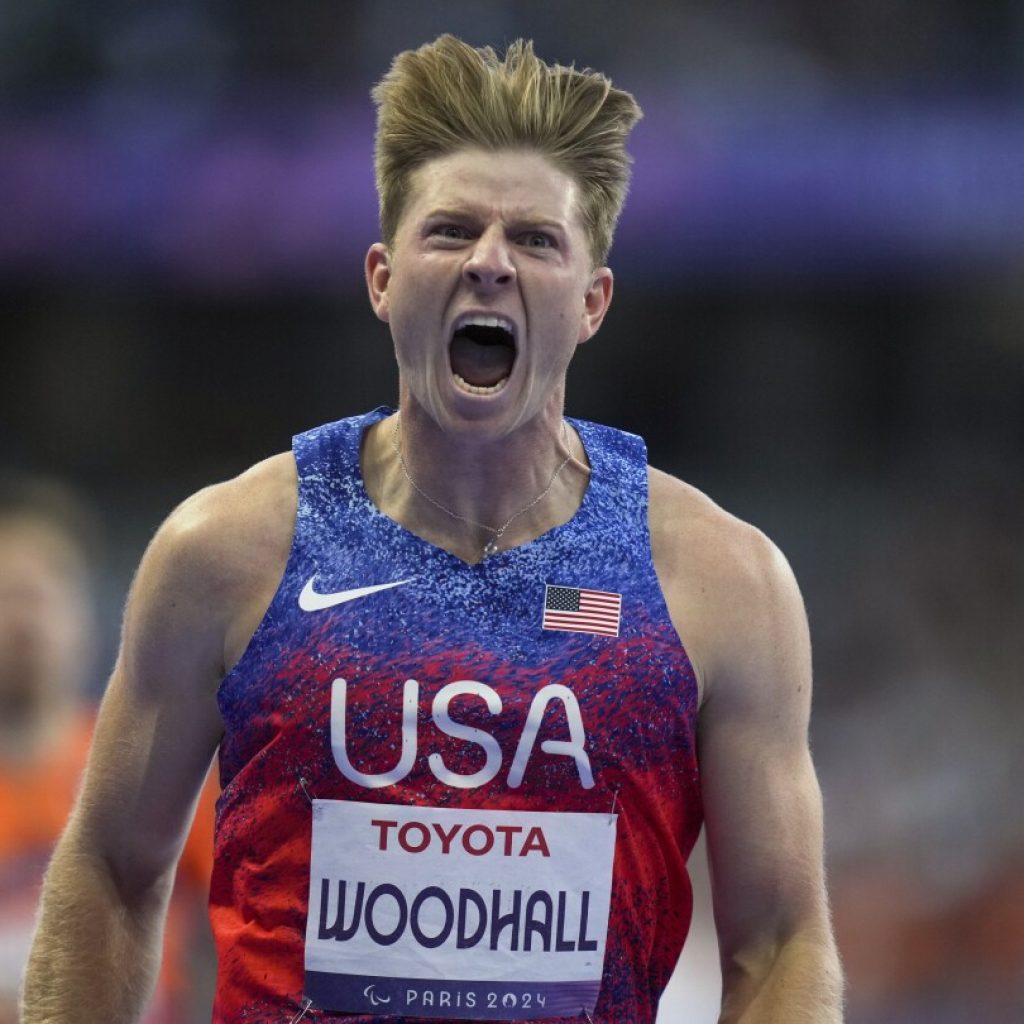 Hunter Woodhall wins Paralympic sprint title to join his wife as a gold medalist