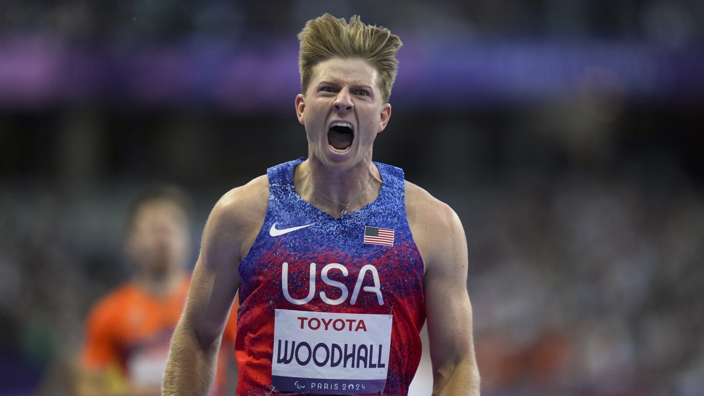 Hunter Woodhall wins Paralympic sprint title to join his wife as a gold medalist