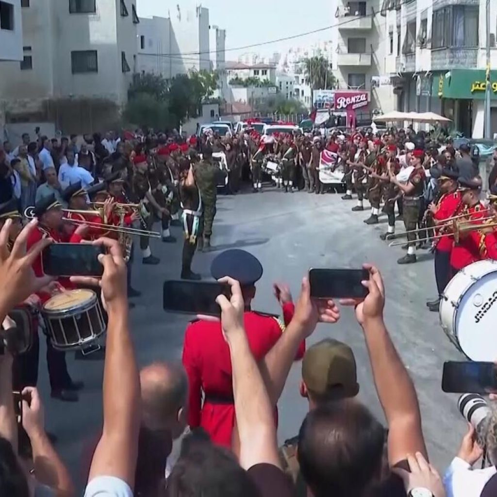 Funeral procession in West Bank for US-Turkish activist witnesses say was shot by Israeli forces | AP News