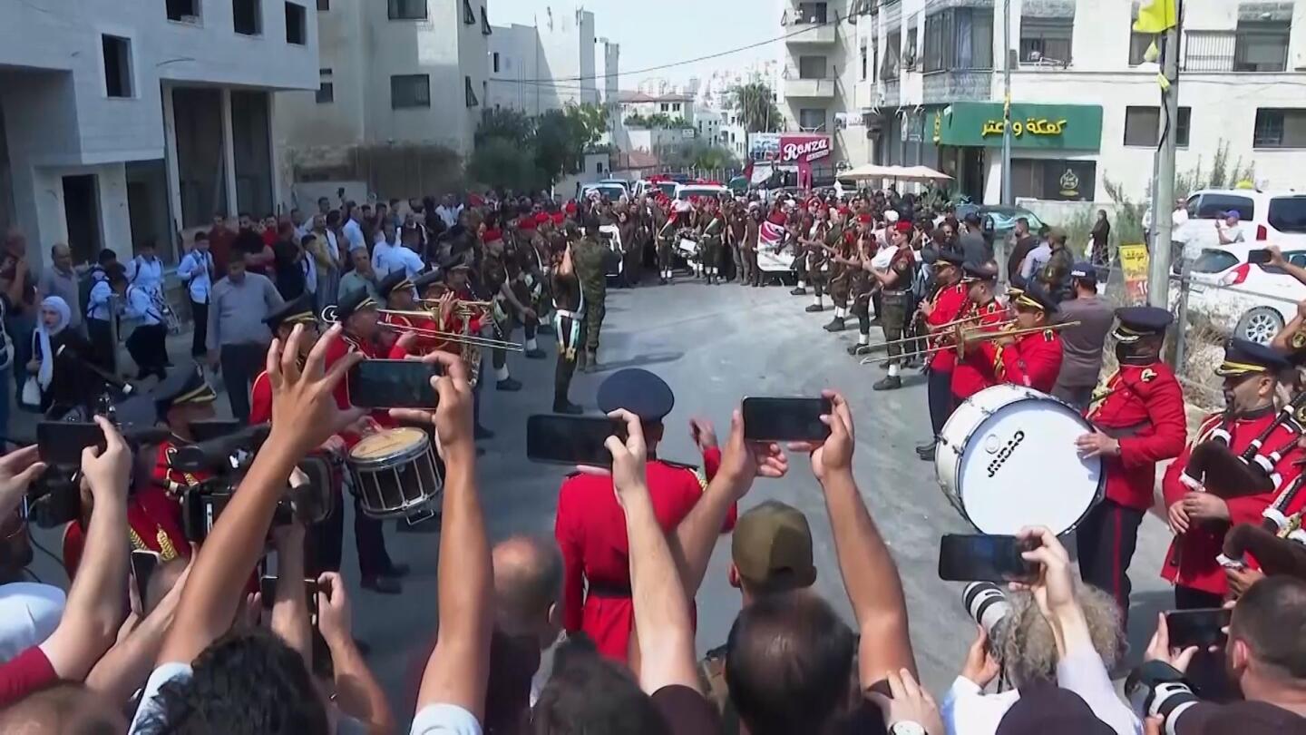 Funeral procession in West Bank for US-Turkish activist witnesses say was shot by Israeli forces | AP News