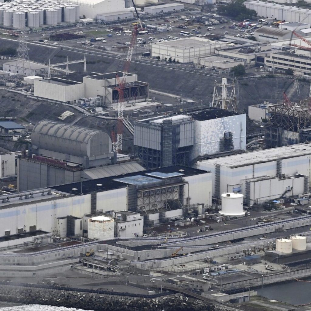 A robot begins removal of melted fuel from the Fukushima nuclear plant. It could take a century