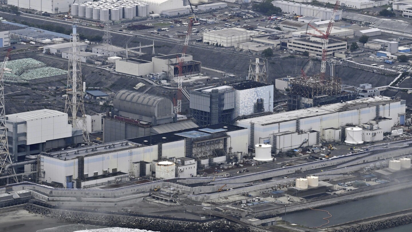 A robot begins removal of melted fuel from the Fukushima nuclear plant. It could take a century