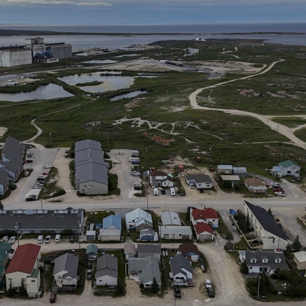 Northern Canadian town adapts and thrives amid climate change | AP News