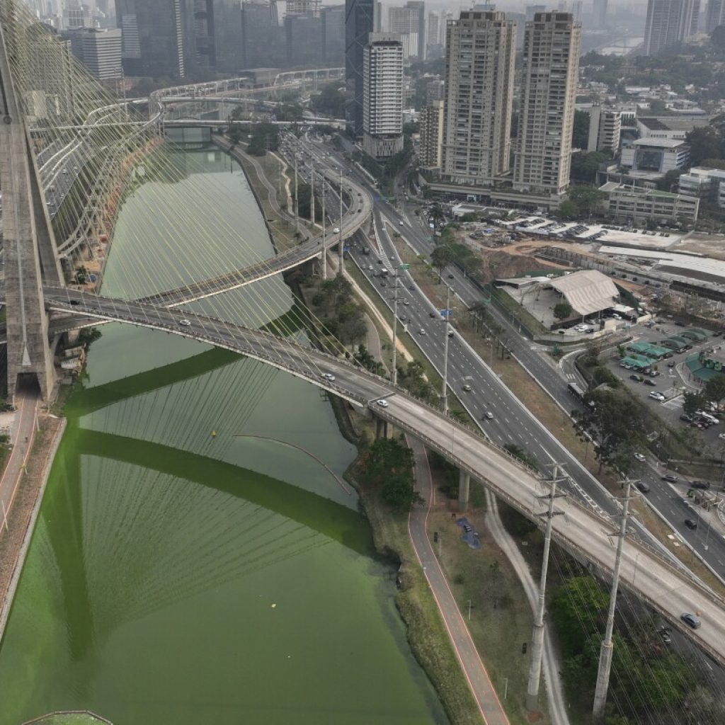 Drought is making Sao Paulo’s river emerald green while smoke turns its skies grey