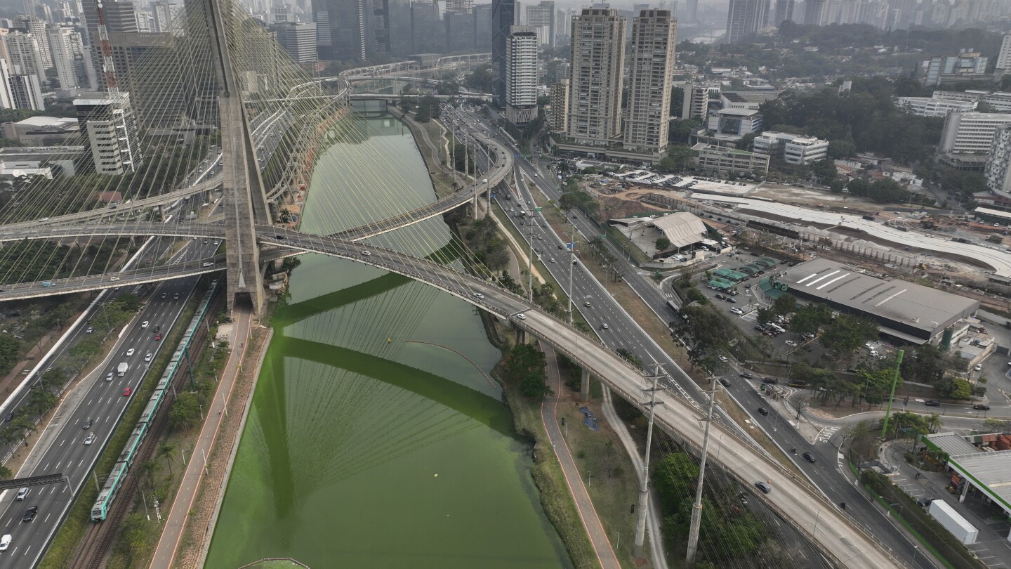 Drought is making Sao Paulo’s river emerald green while smoke turns its skies grey