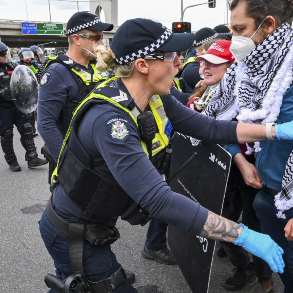 Anti-war protesters clash with police outside Australian arms convention