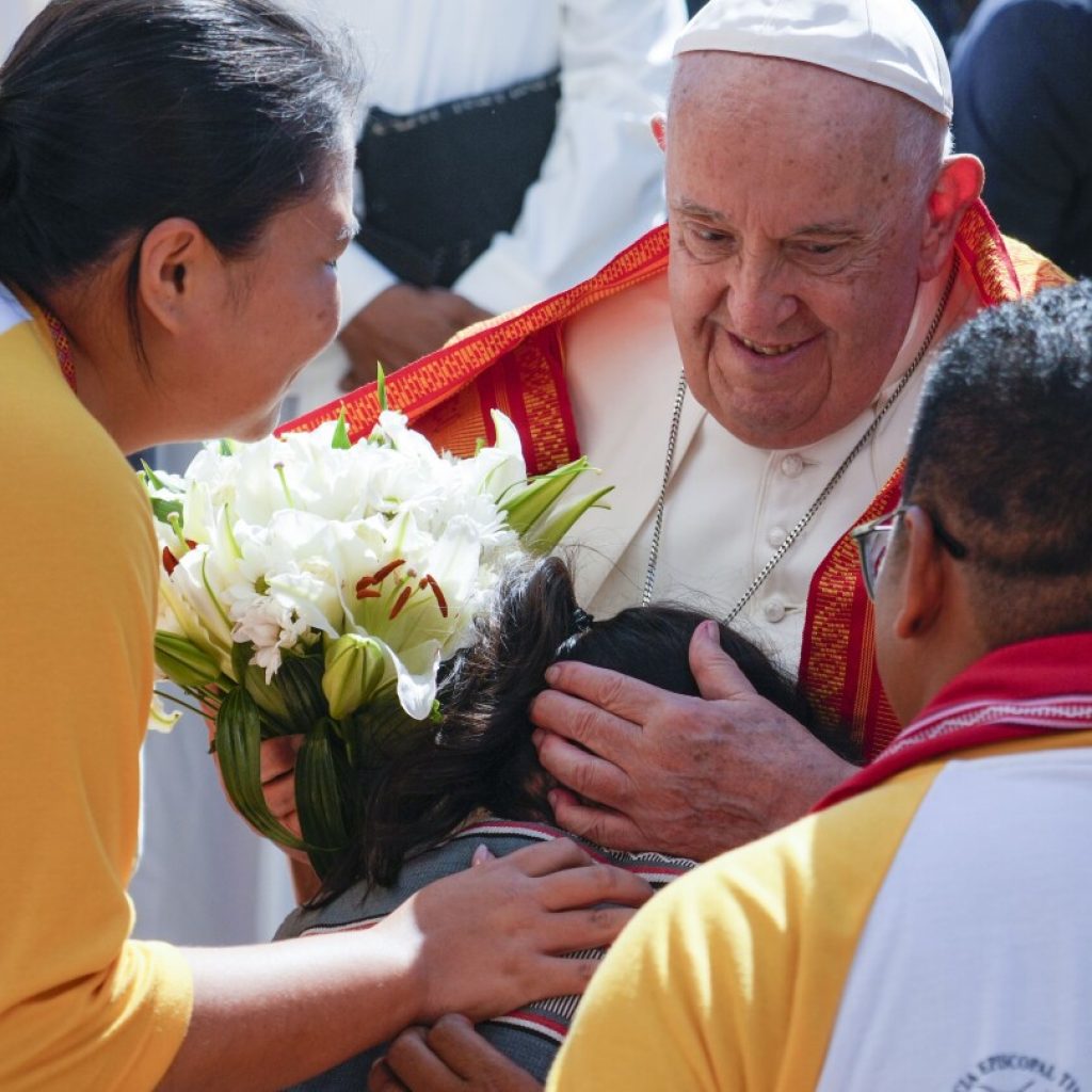 Pope heads to economic power Singapore after a joyous visit to impoverished, devout East Timor