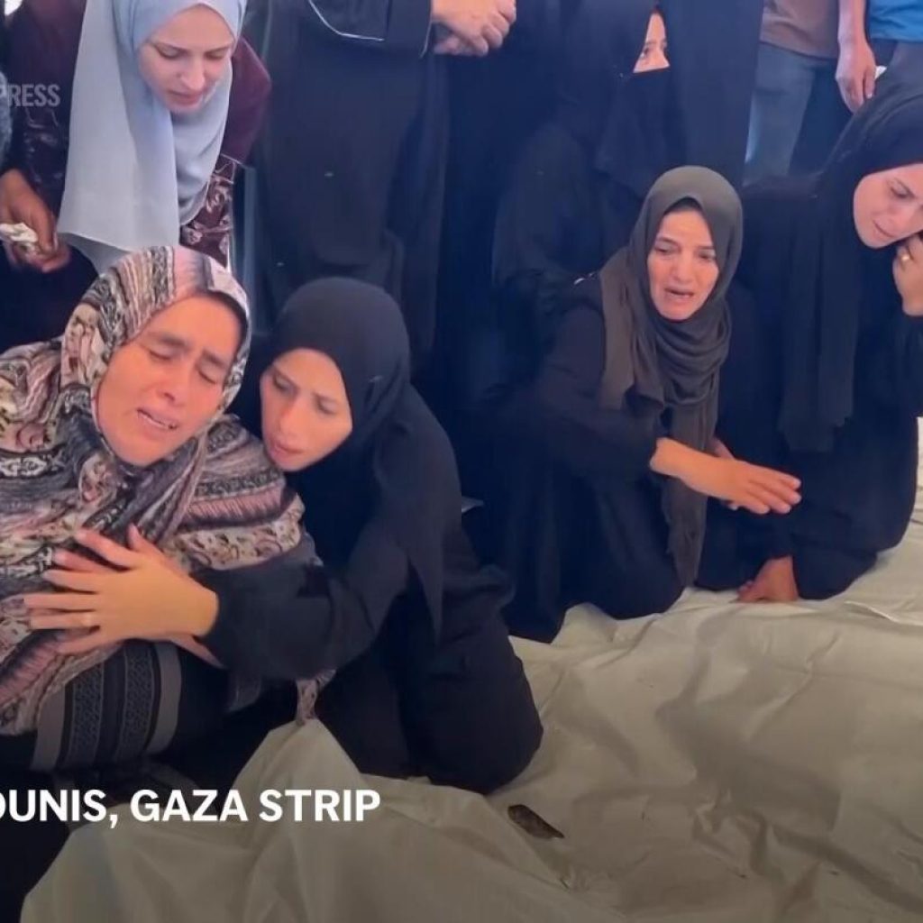 Mourners grieve in morgue after Israeli airstrikes kill at least 20 in Gaza | AP News