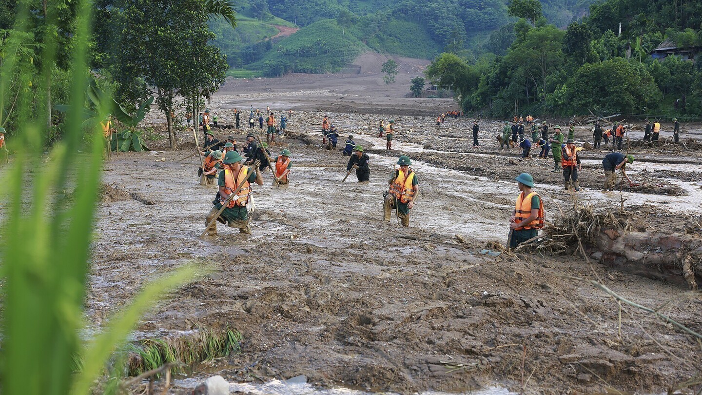 Vietnam typhoon death toll rises to 233 as more bodies found in areas hit by landslides and floods