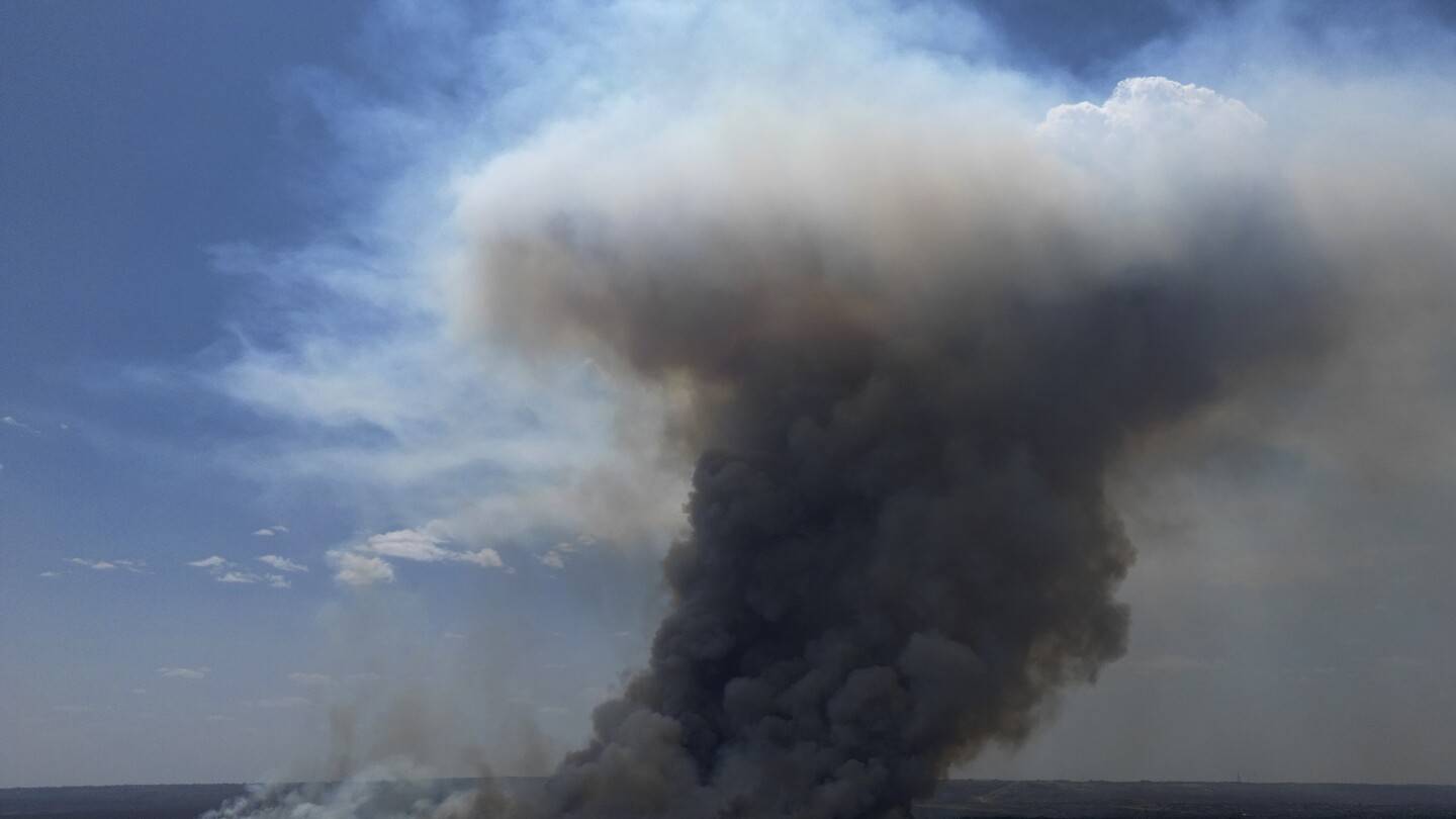 Brazilian firefighters battle national park wildfire that is enveloping Brasilia in smoke