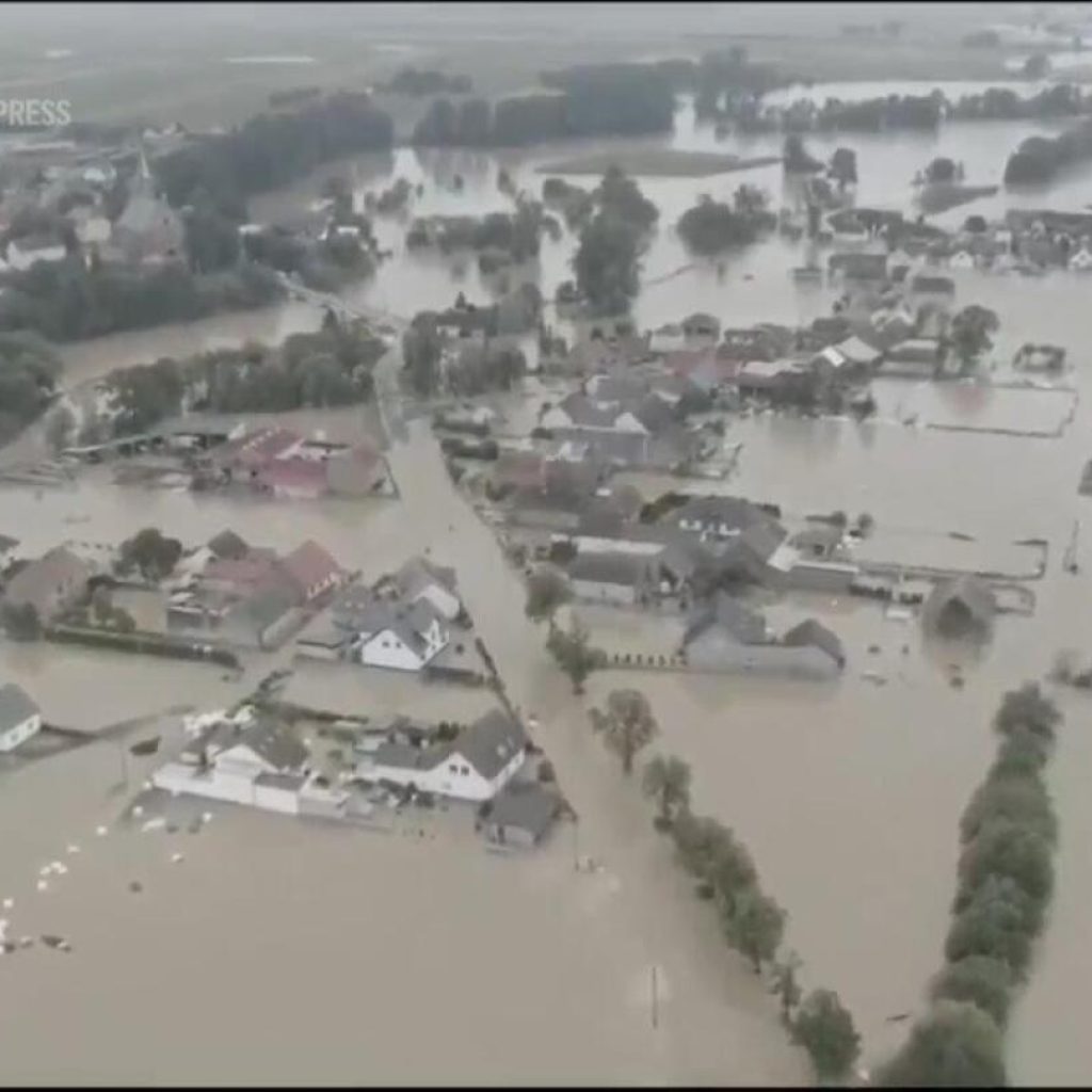 Polish prime minister declares state of natural disaster as volunteers join flood defense effort | AP News