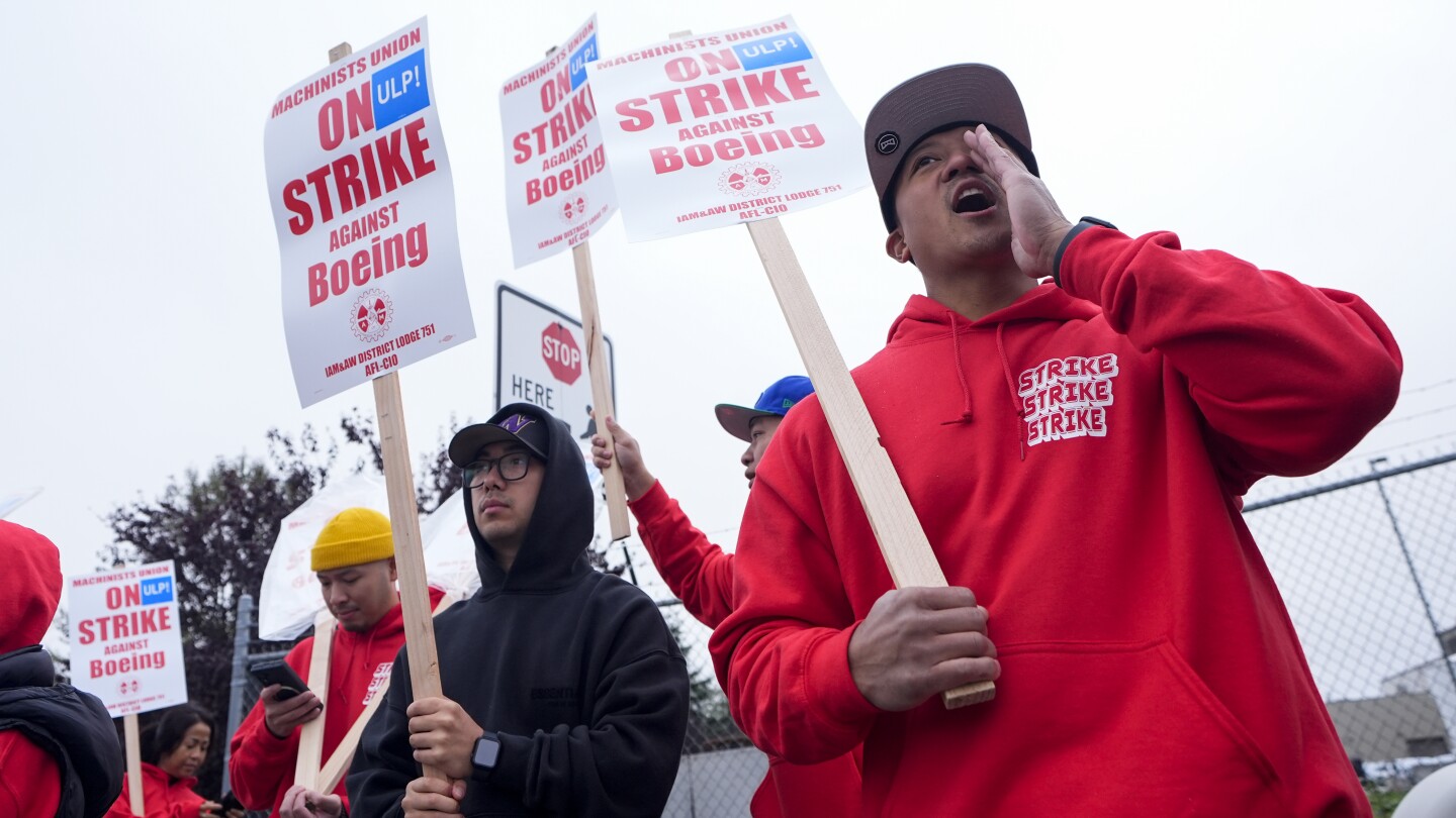 Boeing says it’s considering temporary layoffs to save cash during the strike by machinists