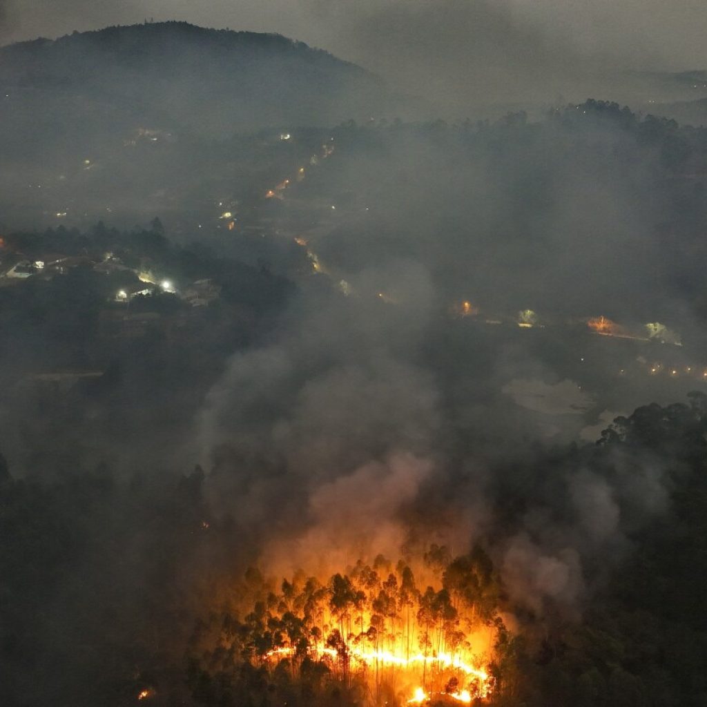 AP PHOTOS: Hallmarks of climate change seen in floods, fires and drought around the globe