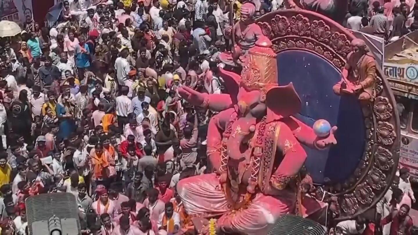 Huge crowd of Hindu faithful celebrates birthday of elephant-headed god Ganesha | AP News