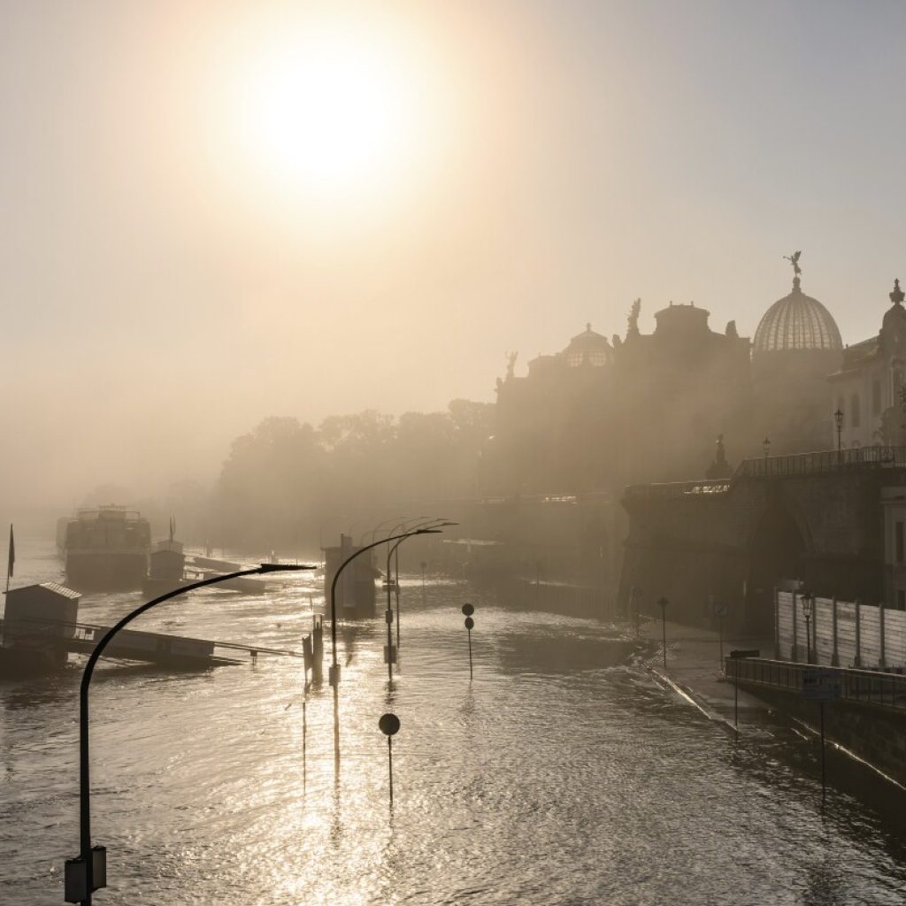 EU warns deadly flooding and wildfires show climate breakdown is fast becoming the norm