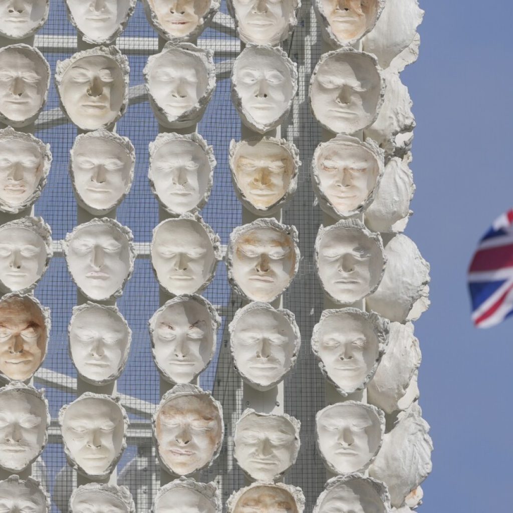 Faces of transgender people adorn an artwork in London’s Trafalgar Square