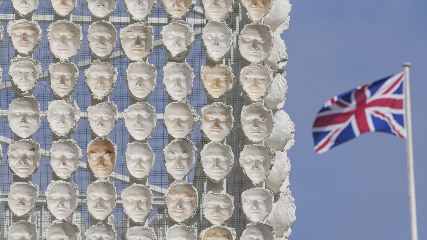 Faces of transgender people adorn an artwork in London’s Trafalgar Square