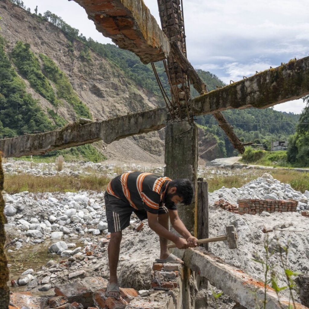 AP PHOTOS: Cascading disasters push residents of a Nepalese valley to the brink