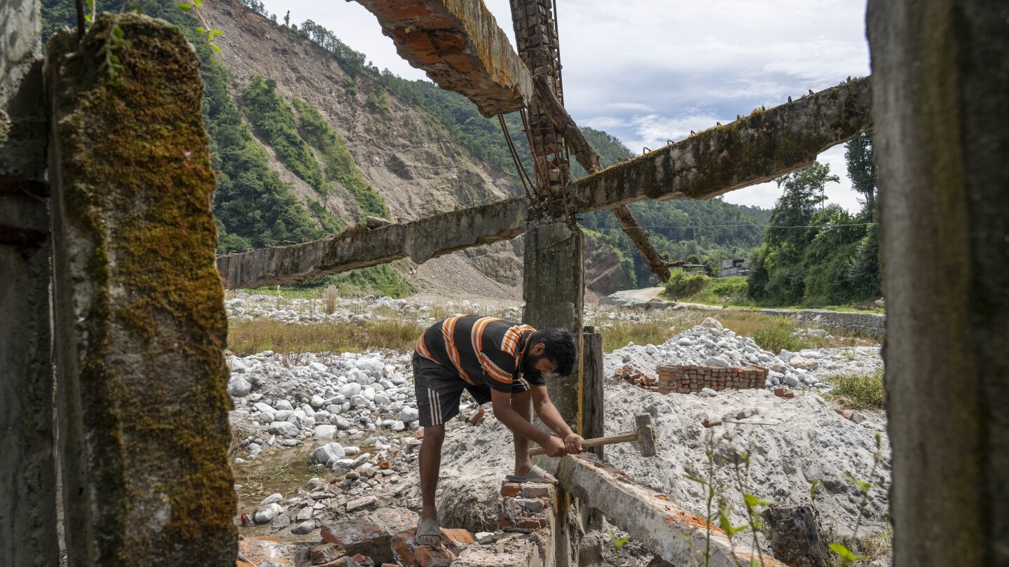 AP PHOTOS: Cascading disasters push residents of a Nepalese valley to the brink