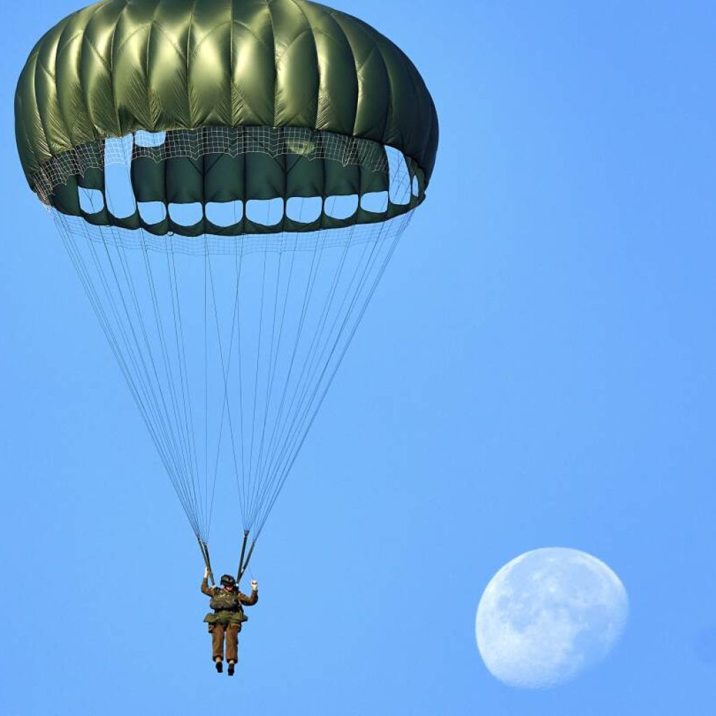 Hundreds of parachutists drop over Dutch heath to commemorate World War II operation