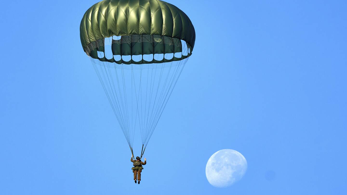 Hundreds of parachutists drop over Dutch heath to commemorate World War II operation