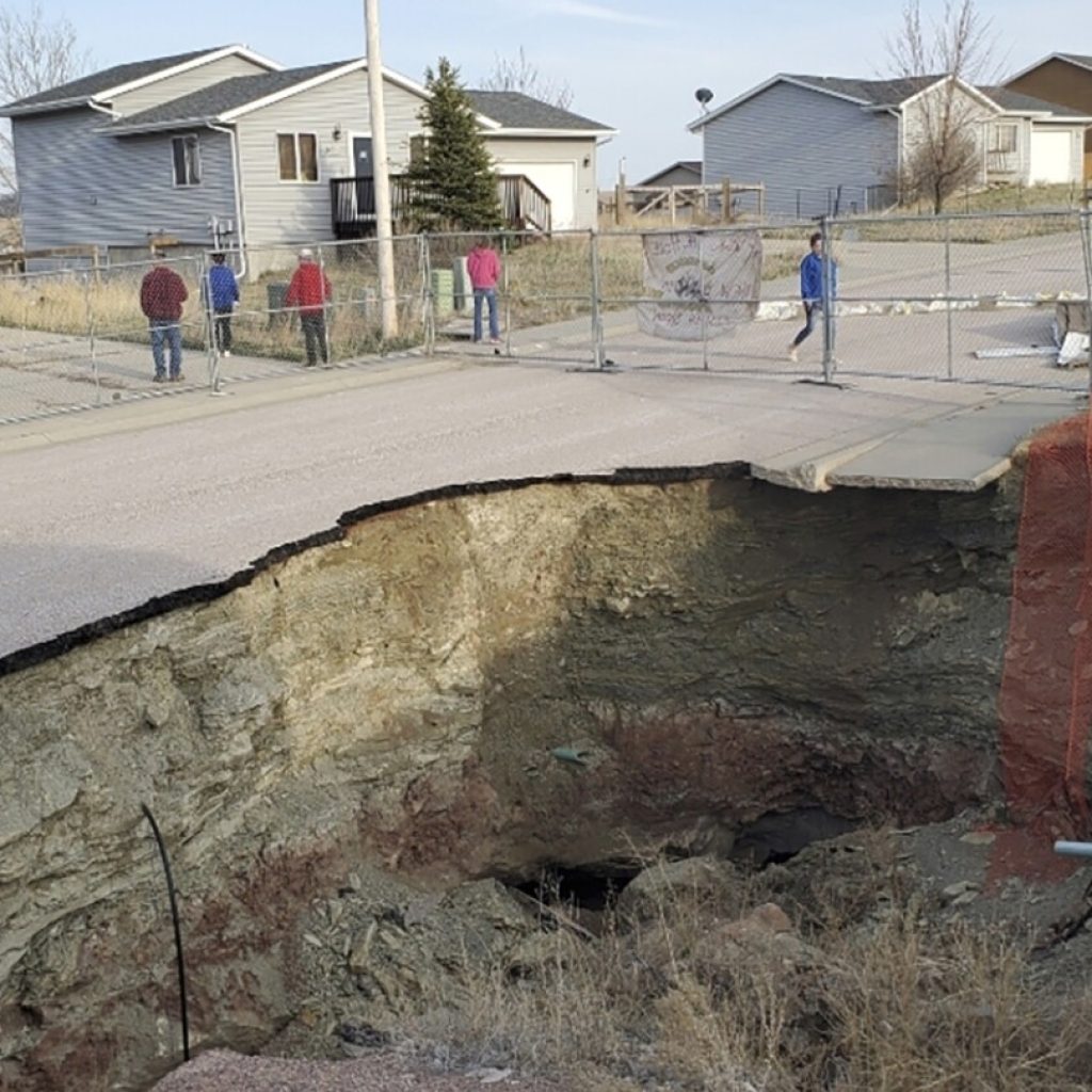 Giant sinkholes in a South Dakota neighborhood make families fear for their safety