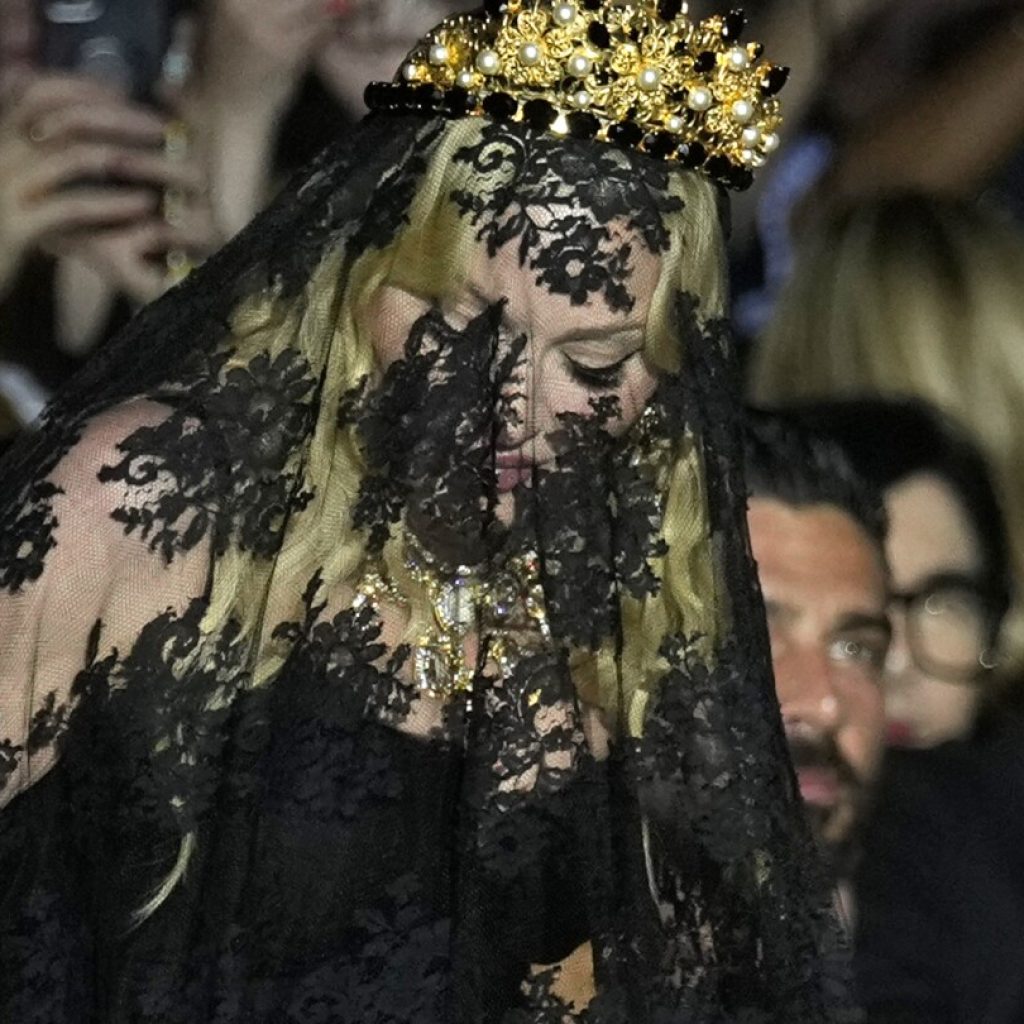 Madonna makes veiled entrance to Dolce&Gabbana for show celebrating her 1990s heyday