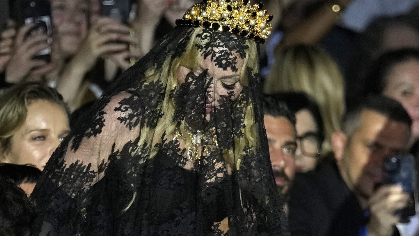 Madonna makes veiled entrance to Dolce&Gabbana for show celebrating her 1990s heyday