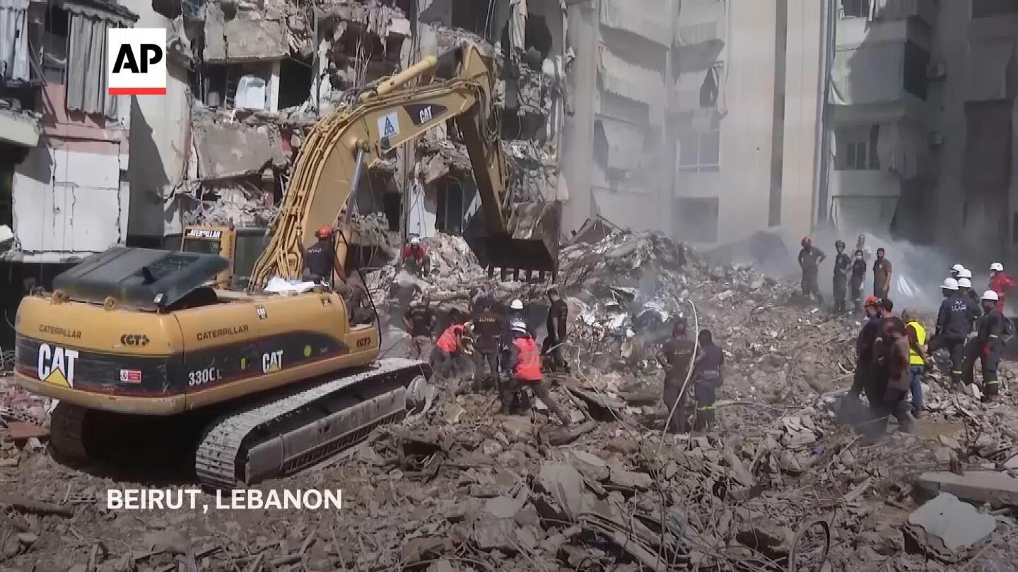 Beirut suburb wakes up to collapsed buildings after Israeli airstrike kills 31 | AP News