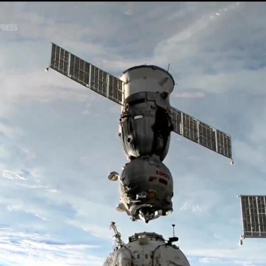 Capsule carrying 2 Russians and 1 American heads to Earth from space station