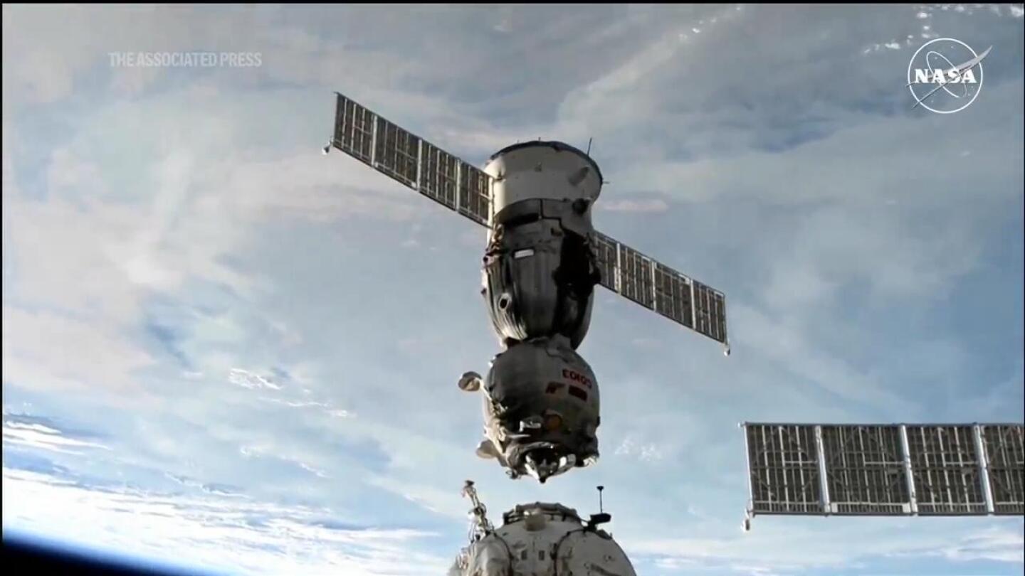 Capsule carrying 2 Russians and 1 American heads to Earth from space station