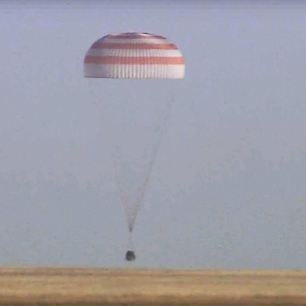 A Soyuz capsule with 2 Russians and 1 American from the International Space Station returns to Earth