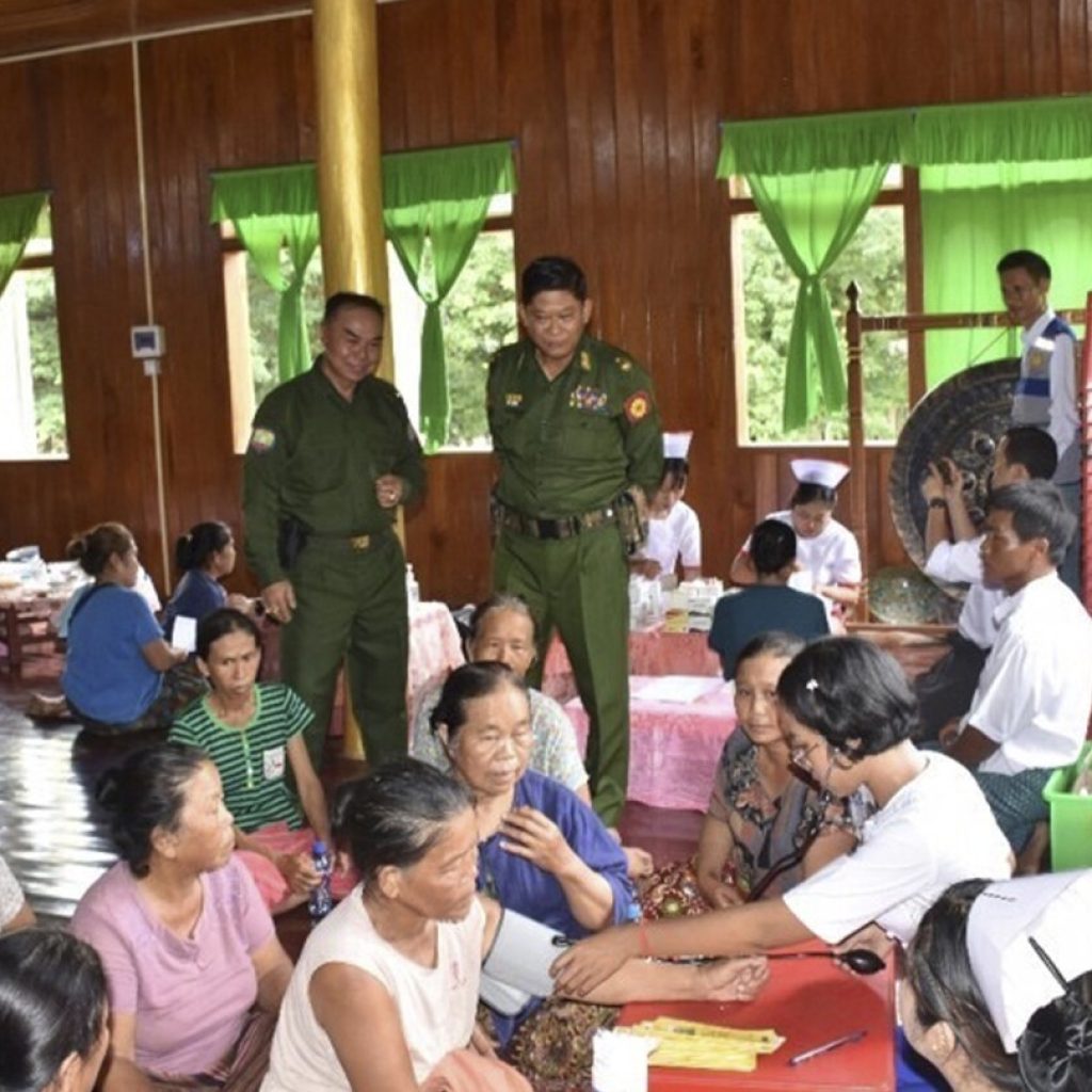 Myanmar soldiers help clean up after a typhoon that killed more than 380 people