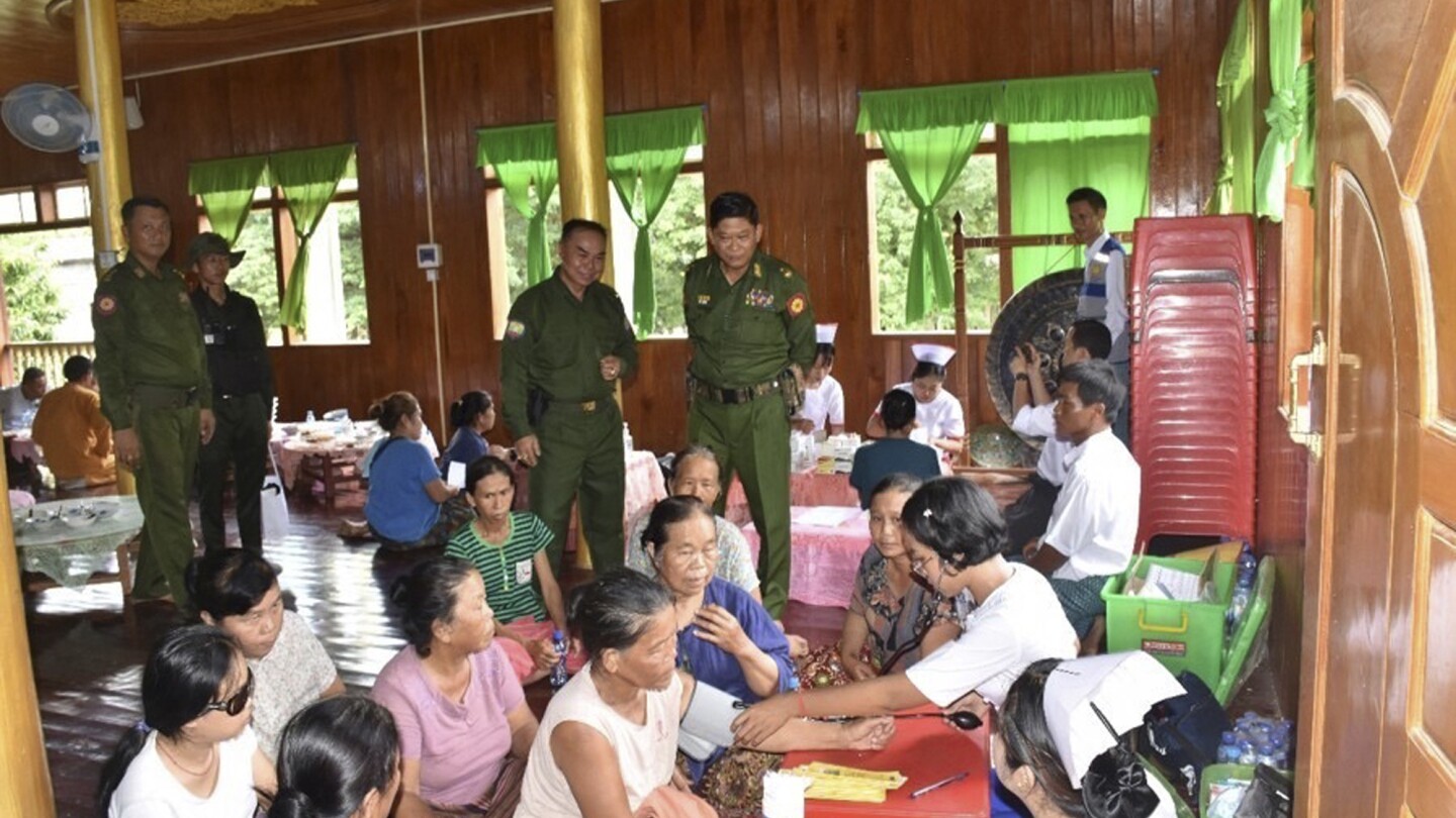 Myanmar soldiers help clean up after a typhoon that killed more than 380 people