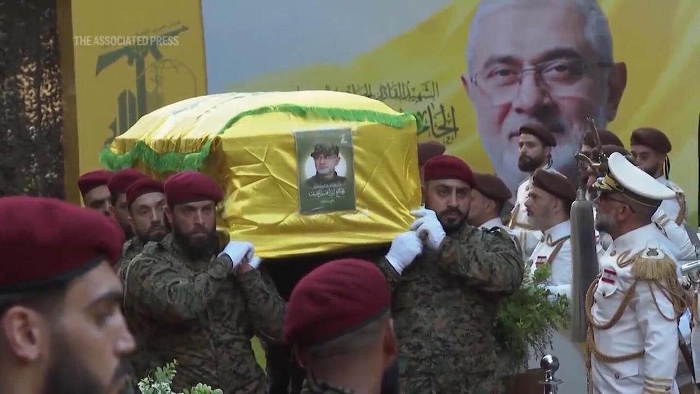 Thousands mourn at funeral for Hezbollah commanders killed in Israeli airstrike on Beirut suburb | AP News