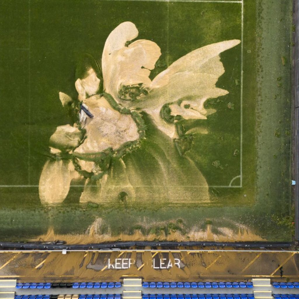 Soccer pitch collapses as parts of the UK are hit by flash floods