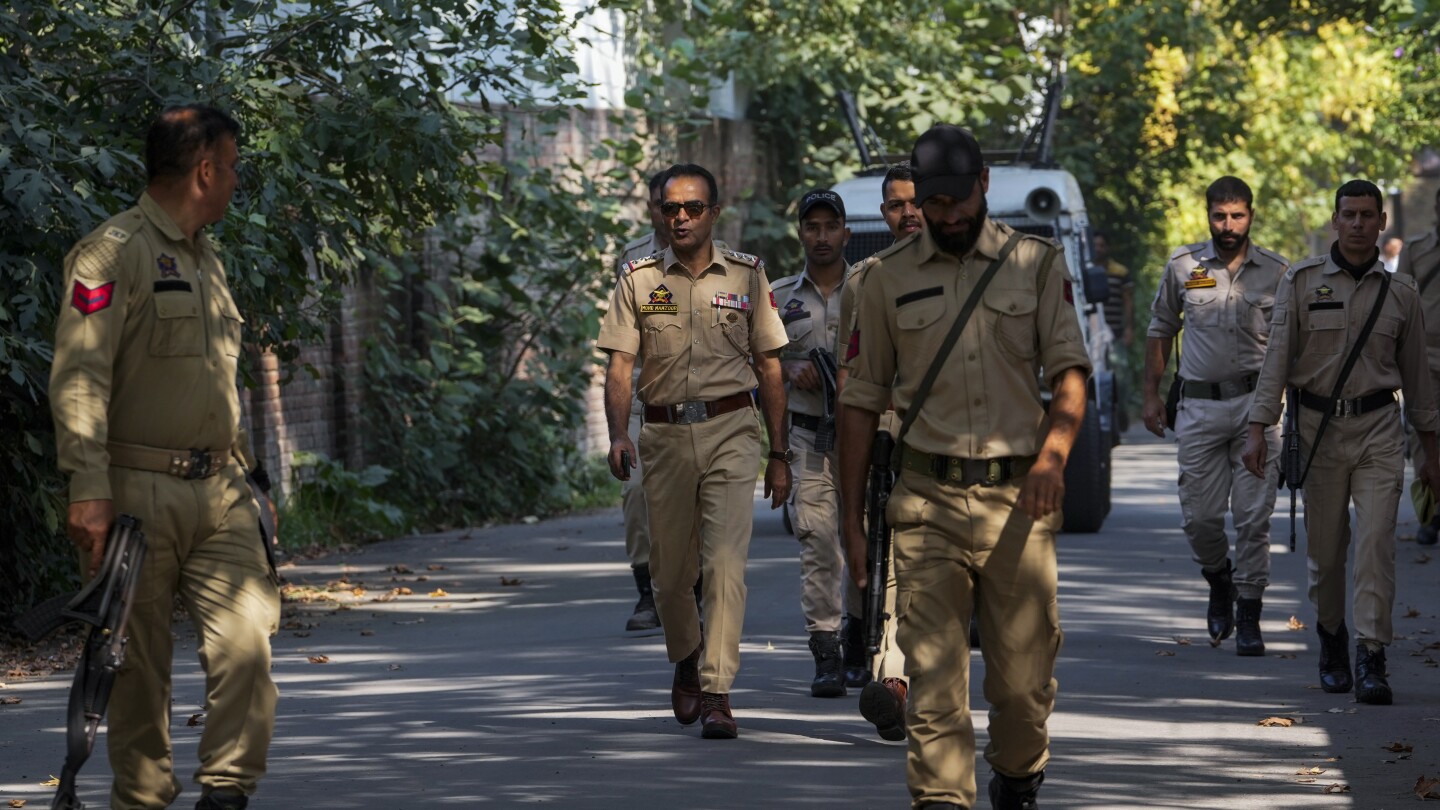 Residents in India-controlled Kashmir vote in the second phase of polls surrounded by heavy security