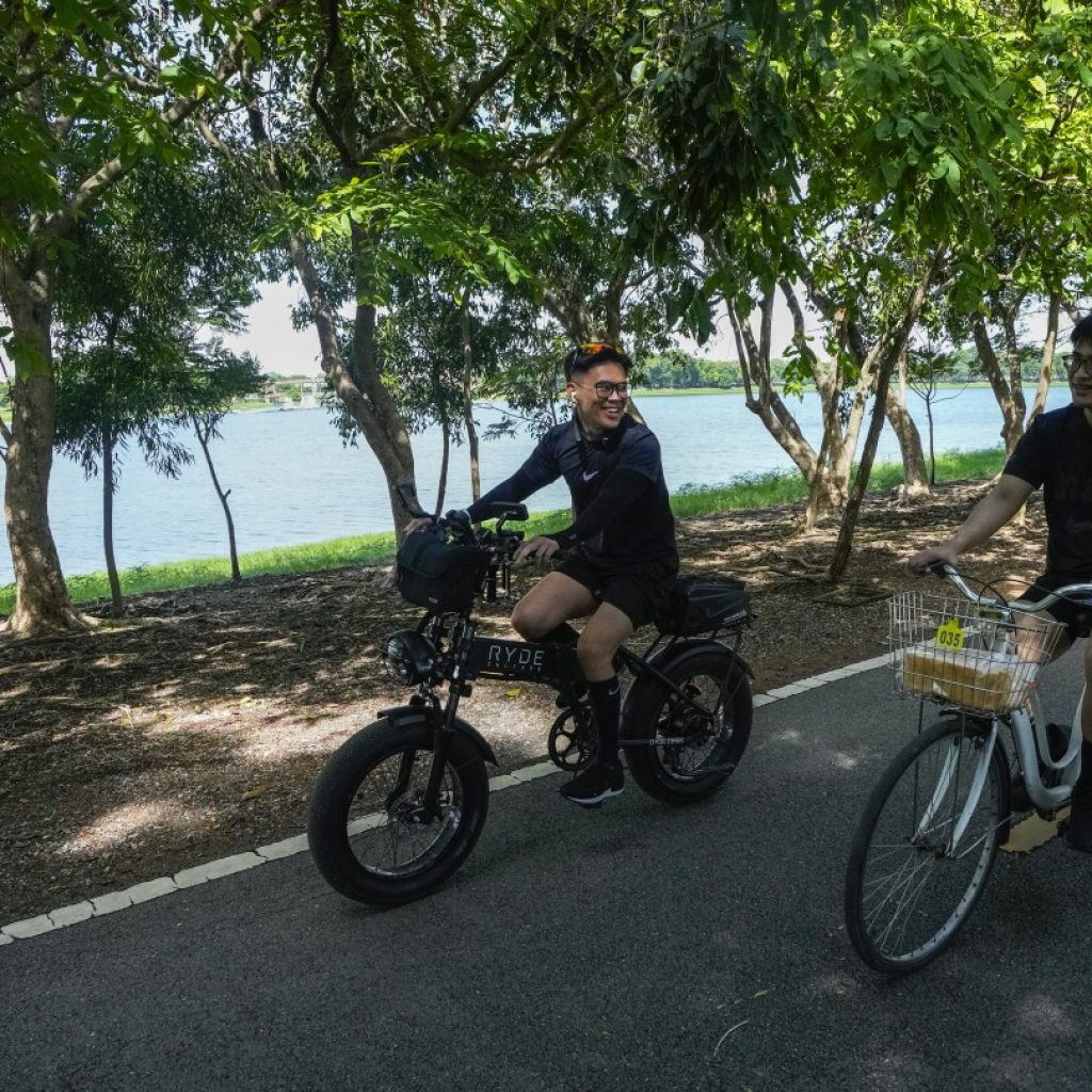 AP PHOTOS: As Thailand approves same-sex marriage, a couple celebrates feeling freed